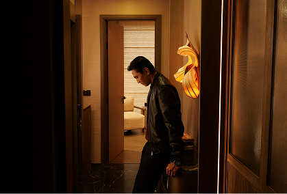 The rooftop infinity pool at dusk above the city skyline